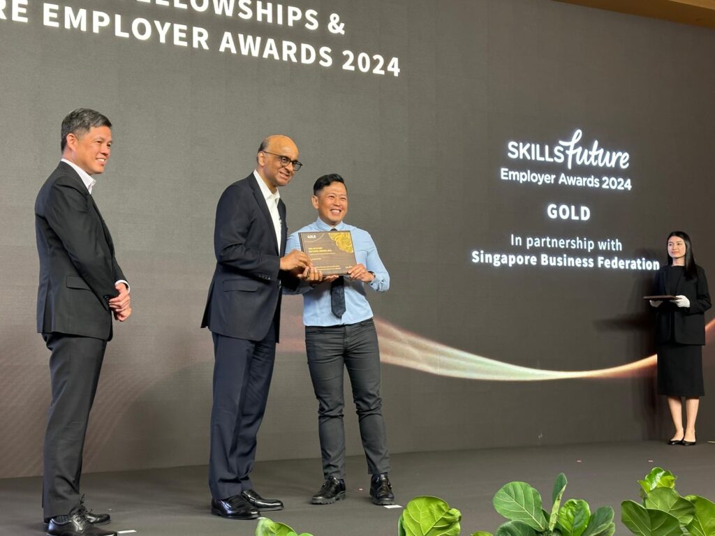 DLE receiving an SkillsFuture Employer Award (Gold) for excellence in staff skills development, technical upgrading, and leadership training.