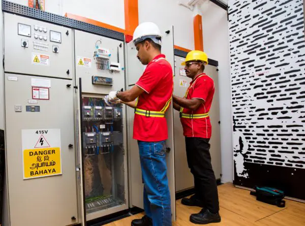 DLE team performing testing, commissioning, and maintenance of electrical systems, including inspections, load analysis, and preventive care.